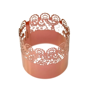 Detail of rose gold laser-cut lace cupcake wrapper for weddings and festive banquets