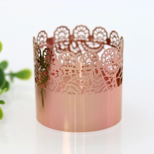 Close-up of rose gold laser-cut lace napkin ring with elegant metallic luster finish