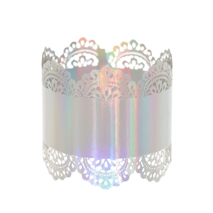 Detail of holographic laser-cut lace napkin ring with iridescent metallic finish