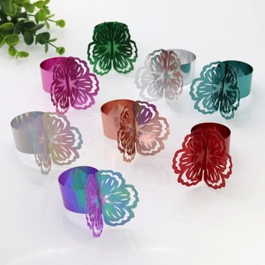 Macro view of assorted hollow flower napkin rings in metallic finish for event decor