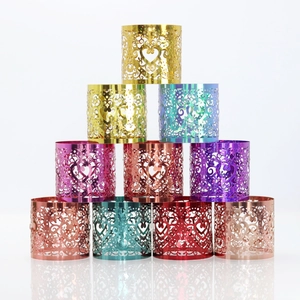 Detailed laser-cut heart pattern on shimmering metallic wedding napkin rings in ten colors
