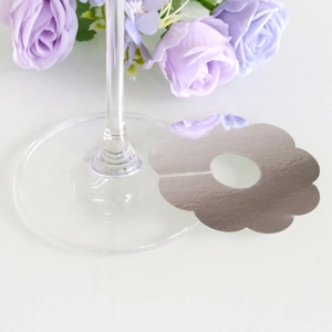 Silver petal-shaped wine glass card with reflective metallic finish for parties