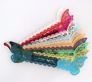 Detailed laser-cut butterfly napkin rings in multiple metallic and matte colors