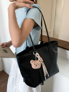 Large black crocodile pattern tote bag for women with bear charm and woven strap detail