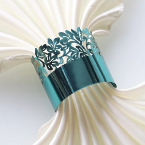 Teal laser-cut leaf pattern napkin ring with metallic finish for wedding table decor