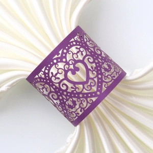 Elegant purple hollow heart napkin ring with laser-cut scroll patterns for wedding decor