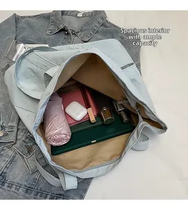 Close-up of the spacious interior of a blue canvas tote bag showing large storage capacity