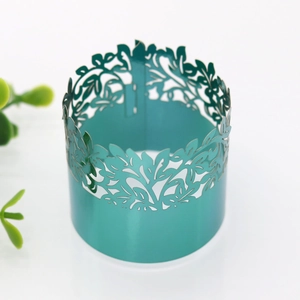 Laser-cut turquoise napkin ring with leaf patterns for festive weddings and parties