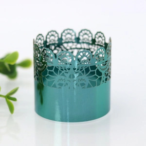 Detailed view of teal lace metal napkin ring featuring intricate floral laser cutouts