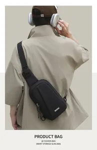 Rear view of a black nylon chest bag for men showing street style and adjustable strap