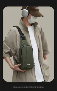 Close-up of olive green high-density oxford chest bag with adjustable strap on model