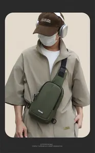 Detail view of military green outdoor chest bag with durable nylon and adjustable strap