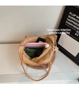 Spacious interior of beige woven tote bag showing internal zipper pocket and daily essentials