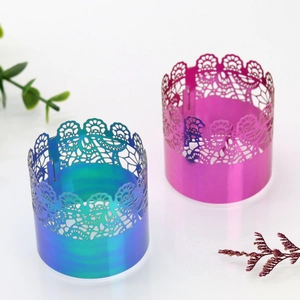 Detailed close-up of laser-cut lace napkin rings with iridescent holographic finish