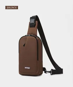 Detail of a brown outdoor crossbody chest bag featuring adjustable strap and MACHUGE label