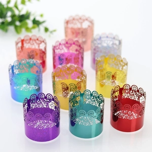 Close-up of laser-cut lace napkin rings in various metallic colors for festive table decor