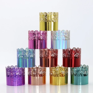 Close-up of laser-cut lace cupcake wrappers in ten metallic colors for parties