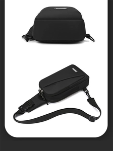 Detail view of black nylon chest bag showing multi-layer zippers and durable buckle strap