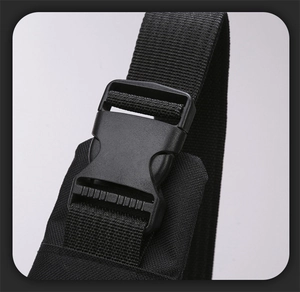Detail of durable black plastic buckle and high-density nylon strap for outdoor chest bag