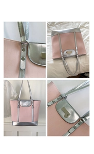 Detail of a large pink tote bag with silver metallic panels and a heart charm pendant