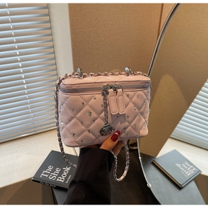 Pink quilted box bag with silver rhinestones and a rose pendant charm detail