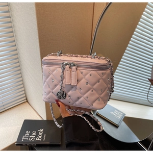 Pink quilted mini vanity bag with crystals and camellia flower charm detail