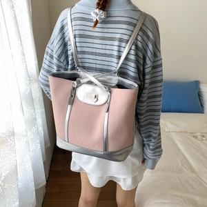 Detailed back view of pink large backpack with heart lock and silver metallic accents