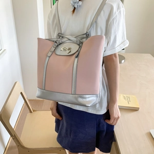 Pink and silver hybrid backpack tote with metallic heart charm and buckle detail