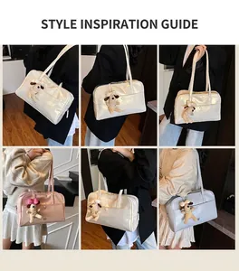 Detail view of colorful Boston bags with glossy PU finish and cute puppy pendants