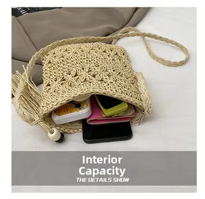 Internal capacity of the handmade straw woven crossbody bag showing phone and card holder