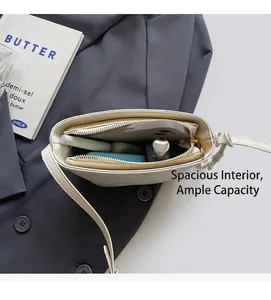 Internal view of white faux crocodile leather bucket bag showing large capacity and pockets