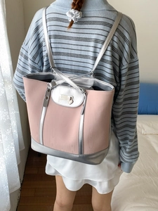 Pink and silver hybrid tote backpack with faux leather finish and heart charm