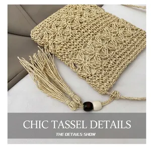 Detail of handmade straw crossbody bag featuring long fringe and decorative wood beads