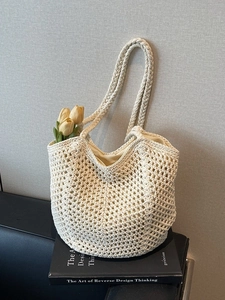 Handmade cream woven crochet tote bag with hollow knit design and sturdy handle