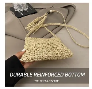 Detail view of woven straw crossbody bag showing the durable bottom and fine textures