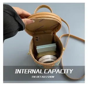 Internal view of denim bucket bag showing storage capacity for phone and cosmetics