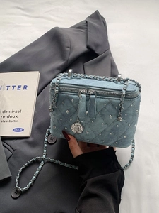 Quilted light blue denim vanity box bag with rhinestones and camellia chain strap