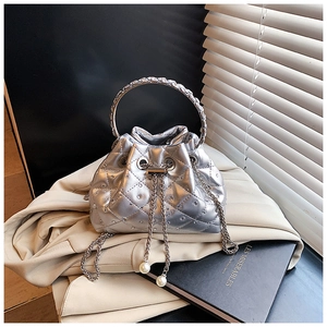 Silver bucket bag with quilted diamonds, rhinestones, and pearl chain strap detail
