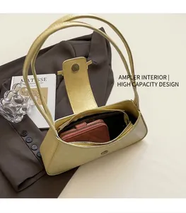 Detailed view of spacious inner compartment in yellow textured leather armpit bag