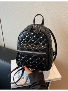 Mini black quilted rhinestone backpack with elegant diamond pattern and metal zippers
