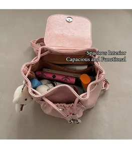 Top view of pink leather backpack interior showing large capacity for mobile and cosmetics