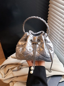 Silver quilted bucket bag with diamond accents, metal handle and pearl drawstring charms