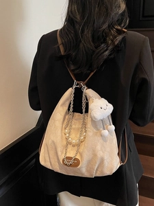Versatile beige and brown crossbody tote bag with dual chain straps and plush cloud charm