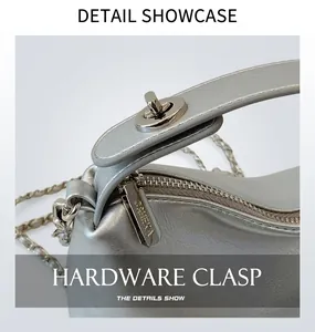 Detailed macro view of the silver metallic bag with a twist lock and engraved zipper