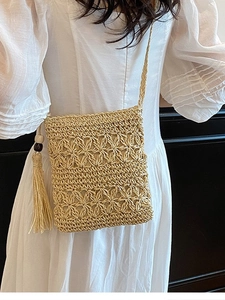 Handmade straw crossbody bag with floral pattern and tassels for summer beach vacation
