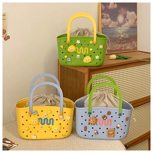 Detailed view of colorful EVA tote bags with cartoon charms and drawstring linen liner