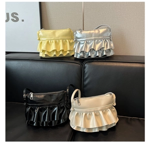 Detailed display of four ruffled bucket bags in yellow, silver, black, and beige colors