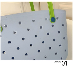 Detail of light blue EVA shower basket featuring round vents and vibrant green handles