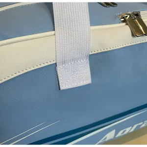 Macro detail of sky blue fitness bag showing reinforced stitching and durable zipper