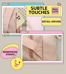 Pink backpack detail showing the anti-theft back pocket and reinforced shoulder strap stitching
